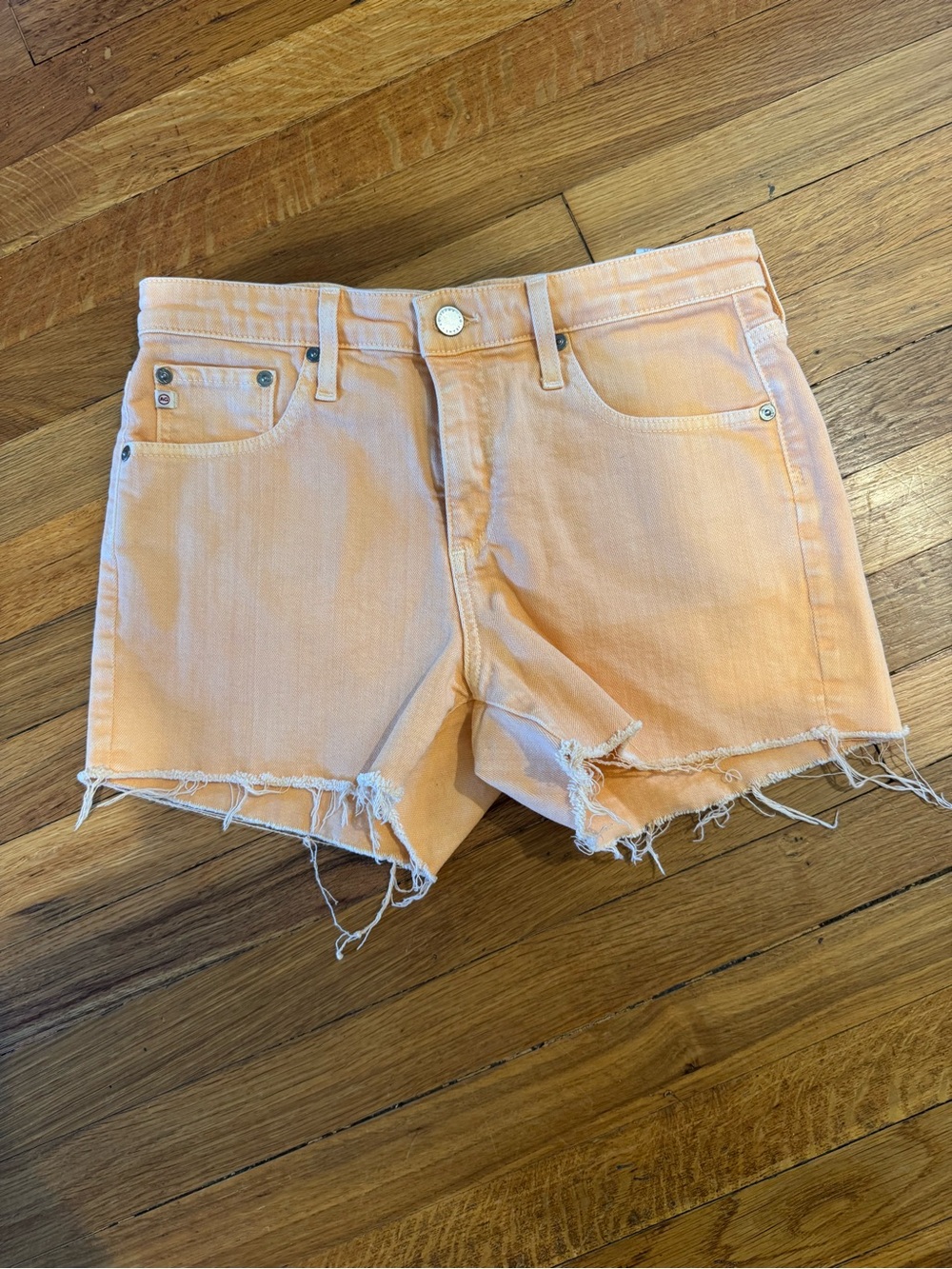 AG Adriano Goldschmied peach-colored raw-hem denim shorts